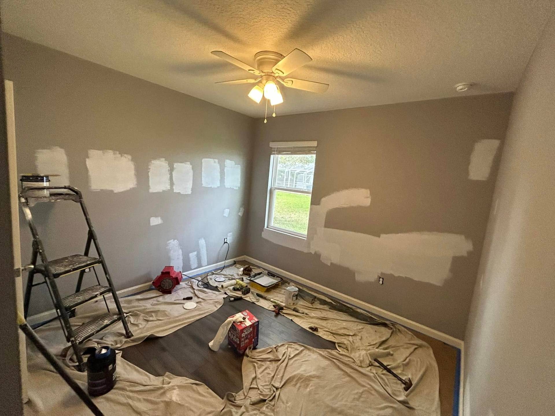 Popcorn ceiling removal and patched drywall ready for paint in a Treasure Coast home by Millman Services.