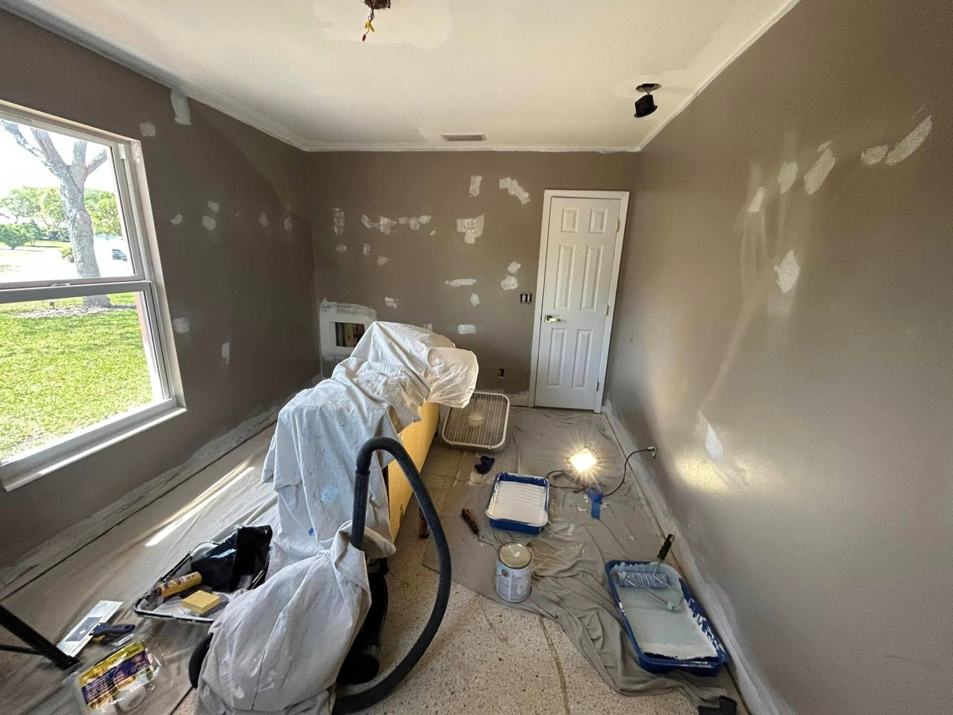 Smooth finished ceiling after popcorn ceiling removal and drywall skim coat