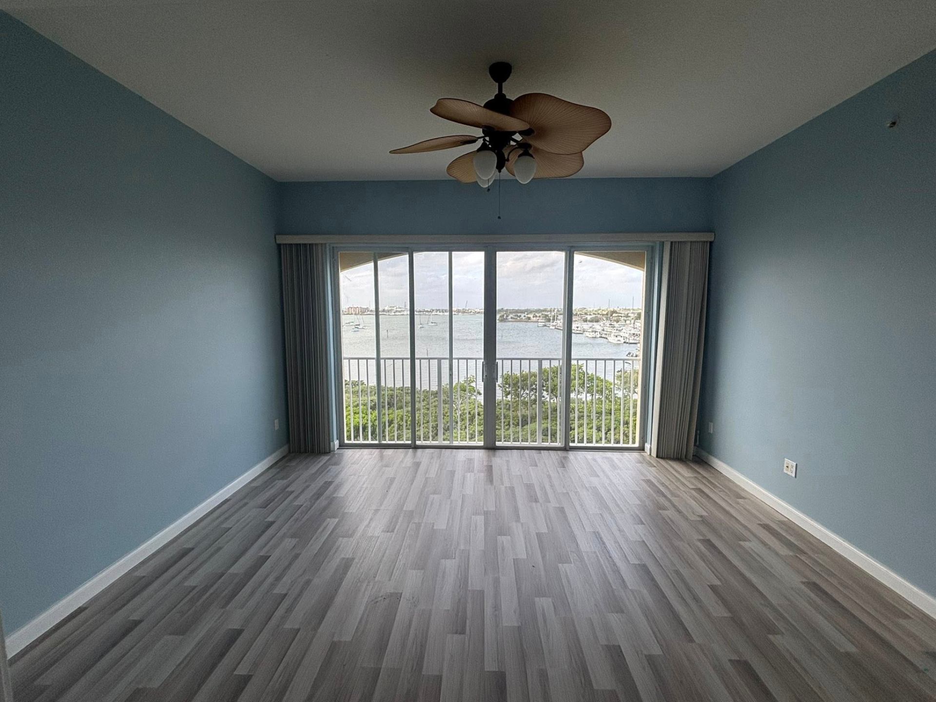Interior repaint of a bedroom with intracoastal views by Millman Services.